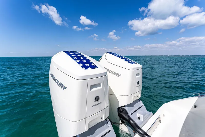 Vantage Yacht Photos Pics Twin Mercury outboard engines on a 2015 Bahama Center Console boat, ocean backdrop.