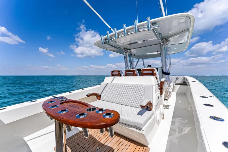 Vantage Yacht Photos Pics 2015 Bahama Center Console boat on open water, featuring seating and rod holders.