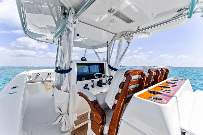 Vantage Yacht Photos Pics 2015 Bahama Center Console boat interior with wooden seats and ocean view.