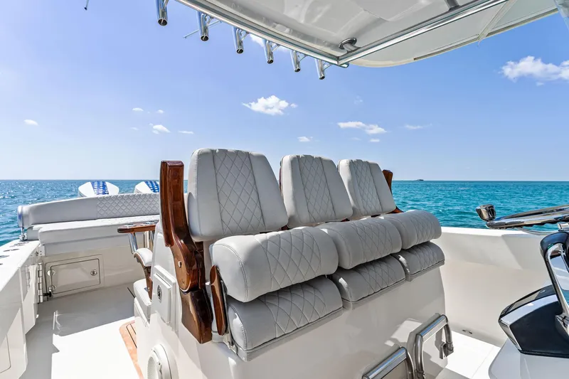 Vantage Yacht Photos Pics 2015 Bahama Center Console boat with cushioned seating, ocean view, and clear blue sky.