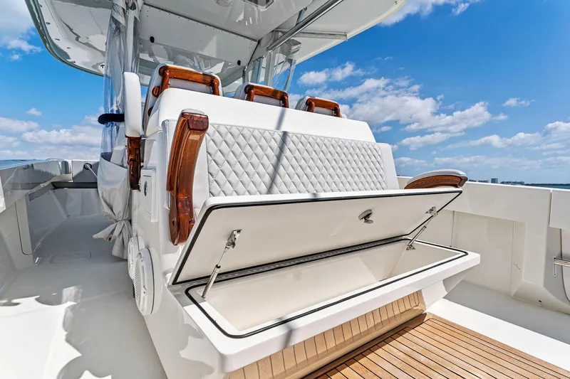 Vantage Yacht Photos Pics 2015 Bahama Center Console boat with open storage compartment, luxurious seating, and clear blue sky.