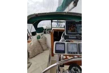 1999 Caliber 40LRC yacht cockpit with navigation equipment and comfortable seating.