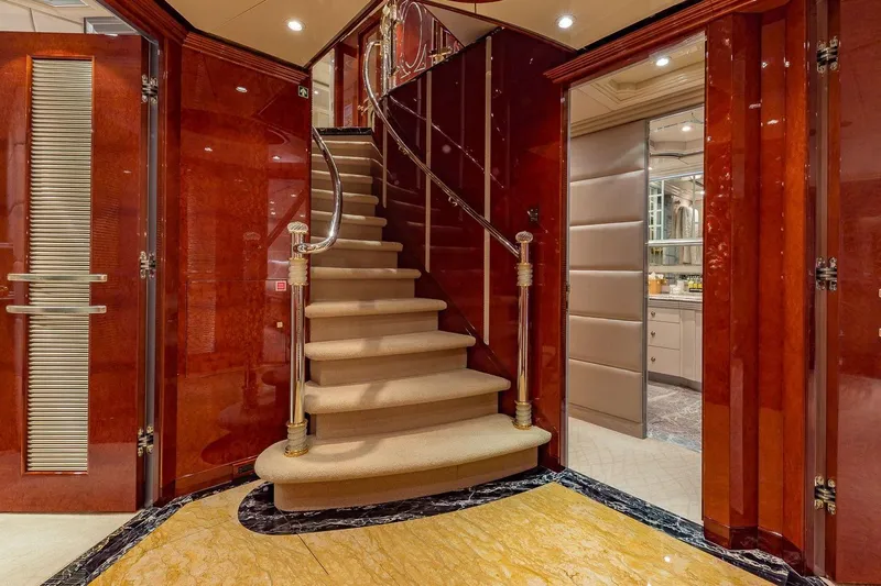 I Love This Boat Yacht Photos Pics Luxurious interior of 2002 Christensen Tri Deck yacht with elegant staircase and polished wood finishes.