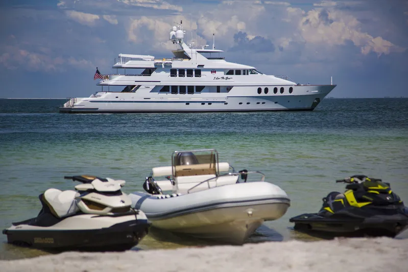 I Love This Boat Yacht Photos Pics Luxury Christensen Tri Deck yacht from 2002 on ocean, with jet skis and inflatable boat.