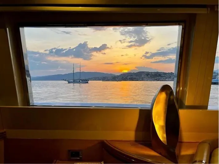  Yacht Photos Pics View of sunset over water from Mondomarine Custom yacht window, 1995 model.