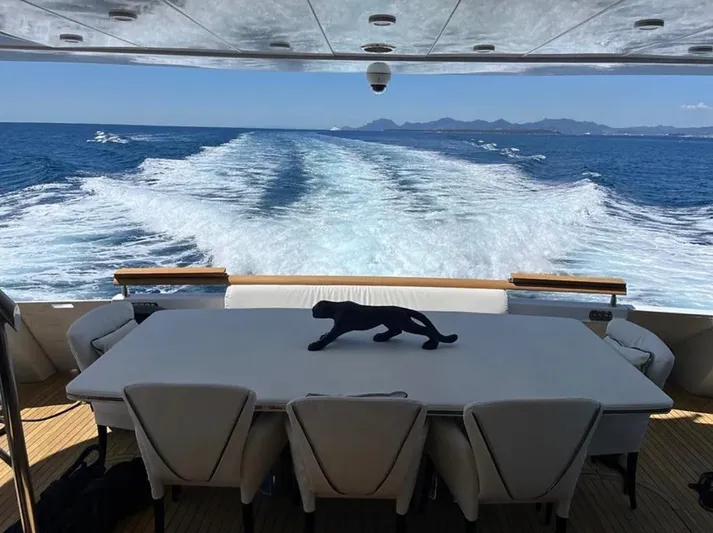  Yacht Photos Pics Luxurious Mondomarine Custom yacht deck with ocean view, table, and chairs, 1995 model.