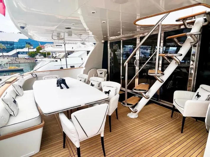  Yacht Photos Pics Luxurious Mondomarine Custom 1995 yacht deck with elegant seating and spiral staircase.