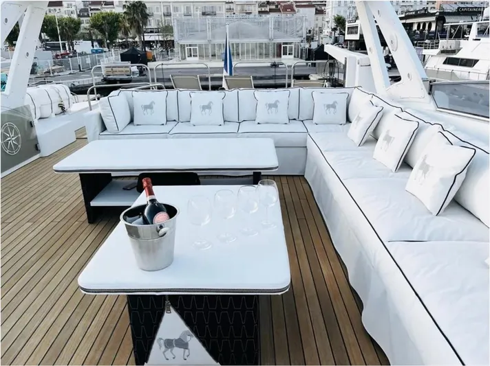  Yacht Photos Pics Luxurious Mondomarine Custom yacht deck with elegant seating, champagne, and glasses, 1995 model.