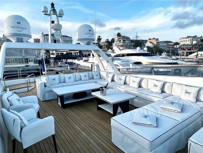  Yacht Photos Pics Luxurious Mondomarine Custom yacht deck with elegant seating, 1995 model, docked in a marina.