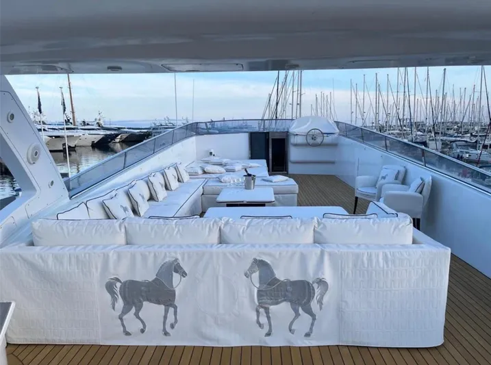  Yacht Photos Pics Luxurious Mondomarine Custom 1995 yacht deck with elegant white seating and horse motif.