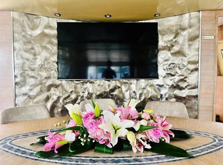  Yacht Photos Pics Luxurious Mondomarine Custom yacht interior with floral centerpiece and modern TV, 1995 model.