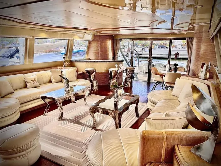  Yacht Photos Pics Luxurious Mondomarine Custom yacht interior, 1995 model, featuring elegant seating and stylish decor.