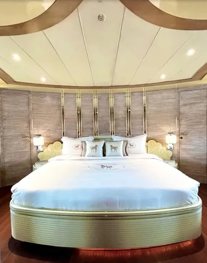  Yacht Photos Pics Luxurious bedroom interior on 1995 Mondomarine Custom yacht, featuring elegant design and plush bedding.