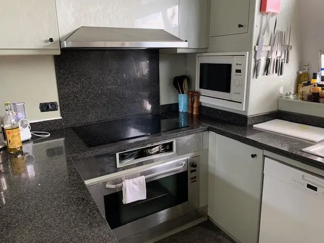  Yacht Photos Pics Modern kitchen with granite countertops, stainless steel appliances, and built-in microwave. Mondomarine Custom 1995.