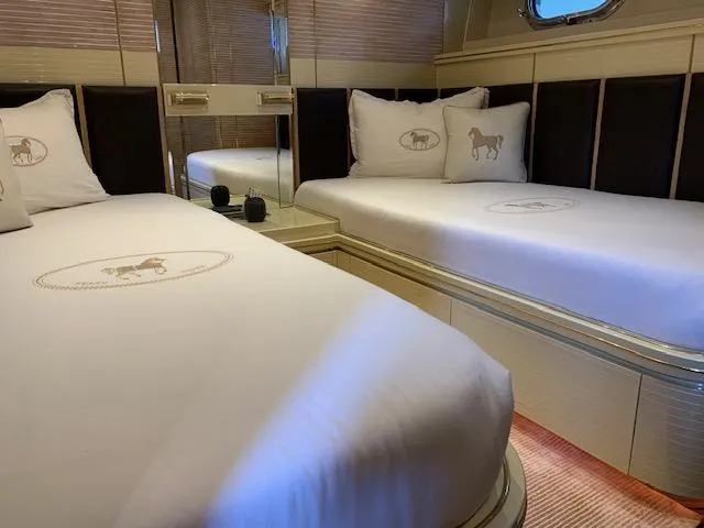  Yacht Photos Pics Luxurious Mondomarine Custom 1995 yacht bedroom with twin beds and elegant decor.