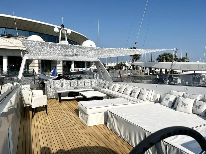  Yacht Photos Pics Luxurious Mondomarine Custom yacht deck with elegant seating, 1995 model, docked at marina.