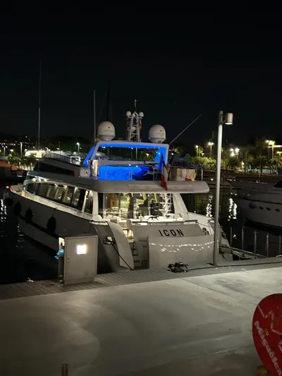  Yacht Photos Pics Luxury Mondomarine Custom yacht docked at night, illuminated with blue lights, 1995 model.