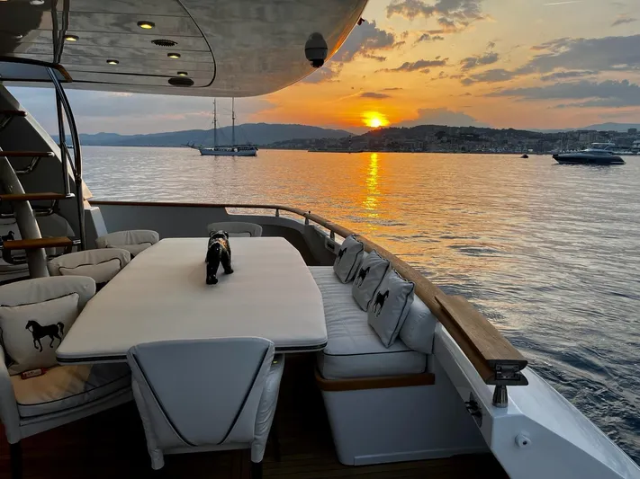  Yacht Photos Pics Luxurious Mondomarine Custom yacht deck at sunset, 1995 model, with scenic ocean view.