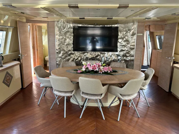  Yacht Photos Pics Luxurious Mondomarine Custom yacht interior with elegant dining area, modern decor, and floral centerpiece, 1995 model.