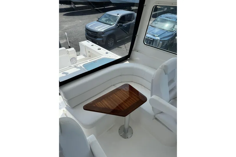  Yacht Photos Pics Interior of 2024 NorthCoast 285 HT with wooden table.