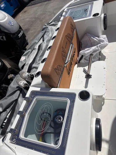  Yacht Photos Pics 2024 Sea Pro 322 DLX Offshore boat interior with storage compartments and seating.