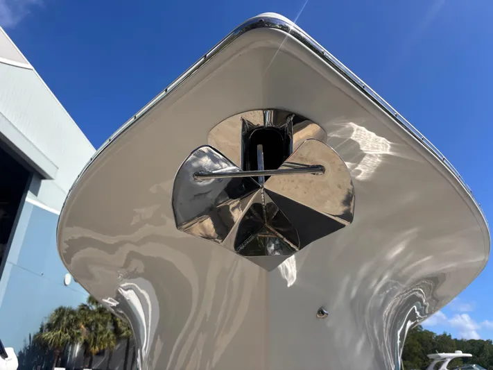  Yacht Photos Pics 2024 Sea Pro 322 DLX Offshore boat bow with anchor, under clear blue sky.