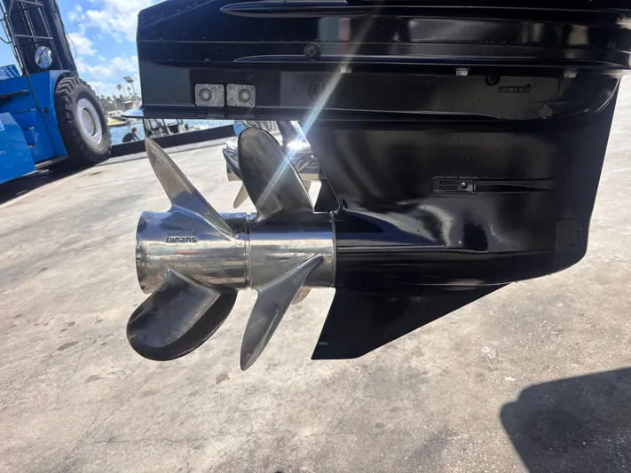  Yacht Photos Pics 2024 Sea Pro 322 DLX Offshore boat propeller in a marina setting.