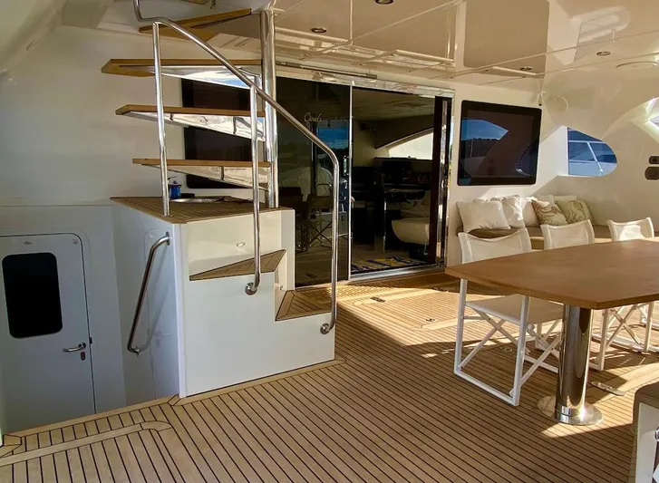 Clouds Yacht Photos Pics Luxurious Sunreef 70 Power yacht deck with elegant seating and modern staircase, 2013 model.