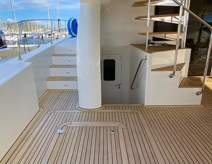 Clouds Yacht Photos Pics Luxurious Sunreef 70 Power yacht deck with wooden flooring and elegant staircase, 2013 model.