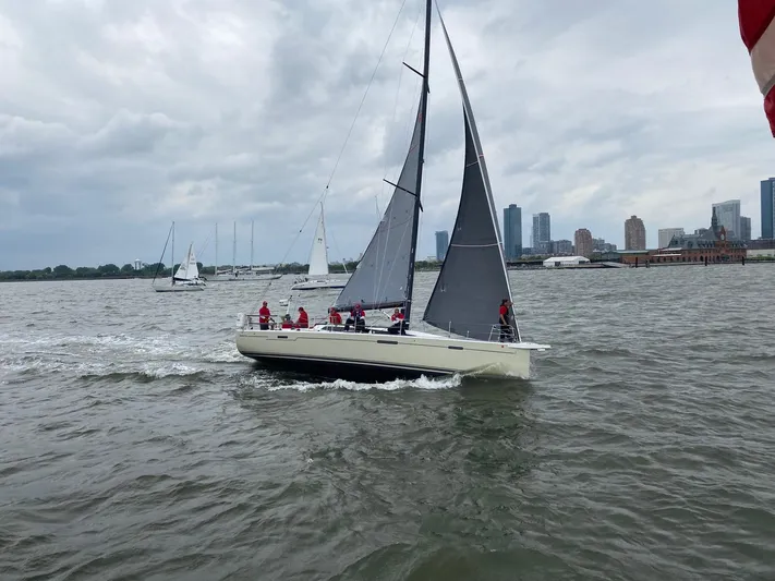 **4806tw Yacht Photos Pics 2017 Dehler 42c sailboat on water with city skyline in background.