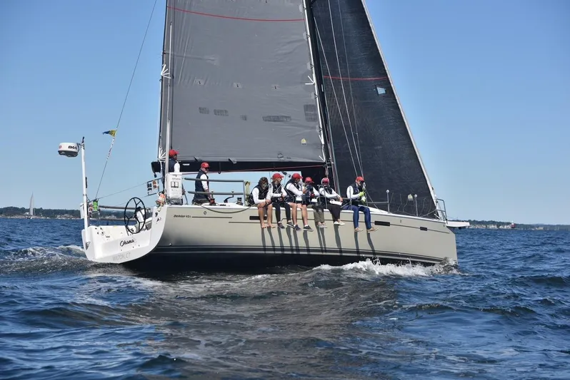 **4806tw Yacht Photos Pics 2017 Dehler 42c sailboat with crew sailing on open water.