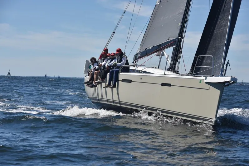 **4806tw Yacht Photos Pics 2017 Dehler 42c sailboat with crew navigating ocean waves.