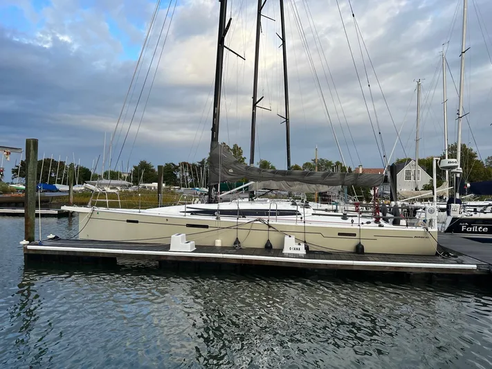 **4806tw Yacht Photos Pics 2017 Dehler 42c sailboat docked at a marina under a cloudy sky.
