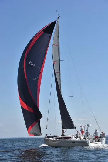 **4806tw Yacht Photos Pics 2017 Dehler 42c sailboat with black and red sails on open water.