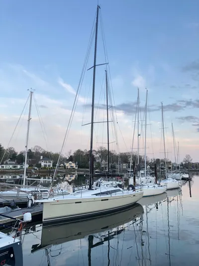 **4806tw Yacht Photos Pics 2017 Dehler 42c sailboat docked at a serene marina during sunset.