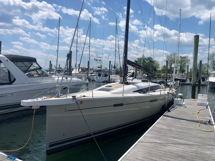 **4806tw Yacht Photos Pics 2017 Dehler 42c sailboat docked at marina under blue sky.