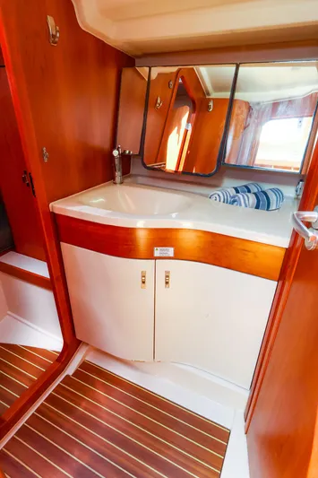 **4806tw Yacht Photos Pics Interior of 2017 Dehler 42c yacht bathroom with wooden cabinetry and modern sink.