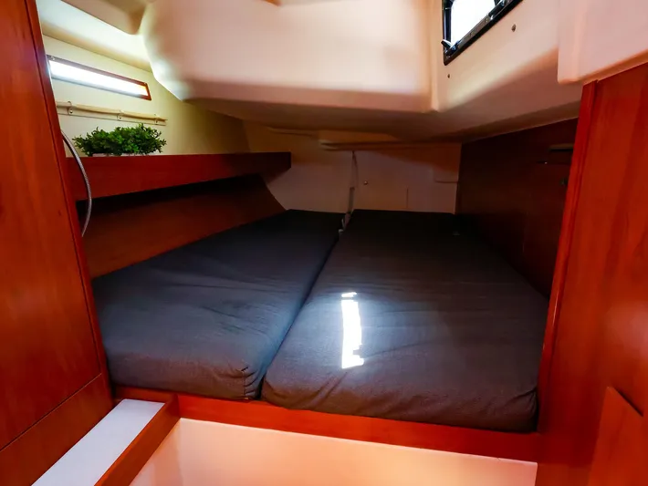 **4806tw Yacht Photos Pics Cozy cabin interior of 2017 Dehler 42c yacht with wooden finish and comfortable bedding.