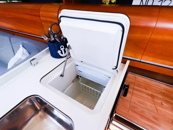 **4806tw Yacht Photos Pics Interior of 2017 Dehler 42c yacht showing open fridge and kitchen area.