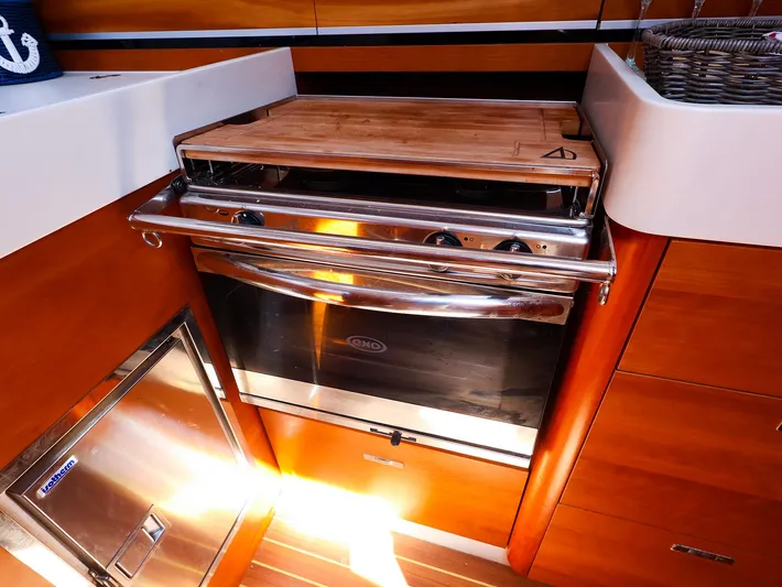 **4806tw Yacht Photos Pics 2017 Dehler 42c yacht kitchen with stainless steel oven and wooden cabinetry.