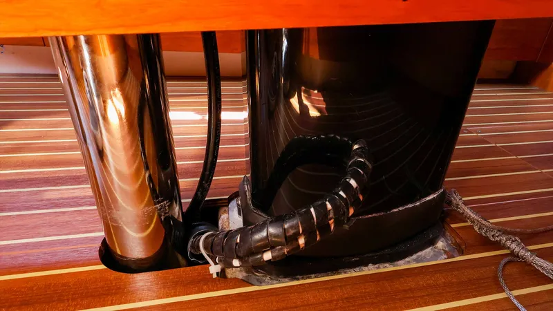 **4806tw Yacht Photos Pics Interior view of 2017 Dehler 42c yacht, showcasing polished metal and wood flooring.