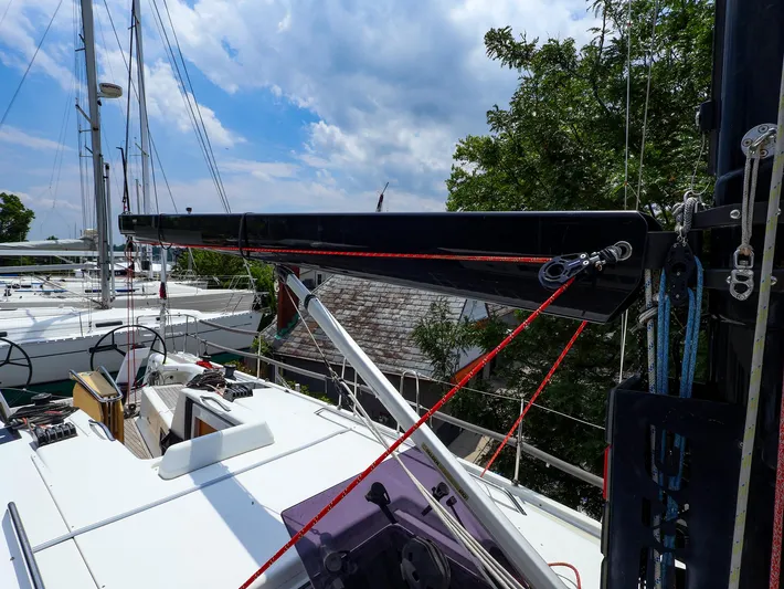 **4806tw Yacht Photos Pics 2017 Dehler 42c sailboat deck with rigging and boom under a partly cloudy sky.