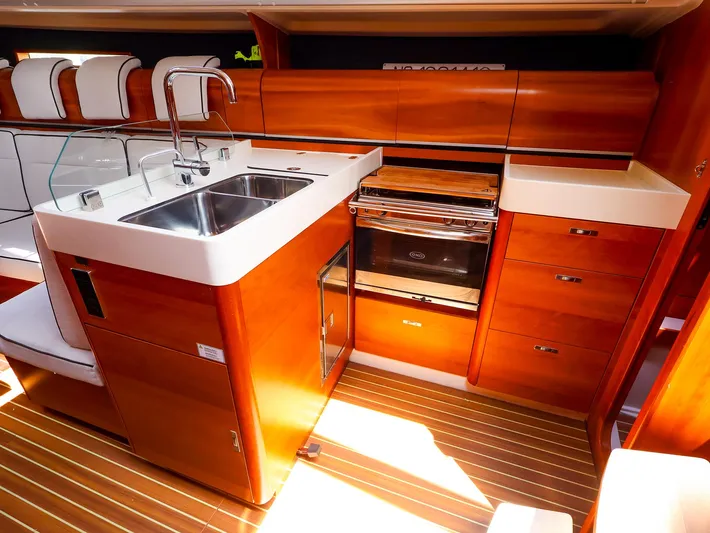 **4806tw Yacht Photos Pics Luxurious 2017 Dehler 42c yacht interior kitchen with wood finish and modern appliances.