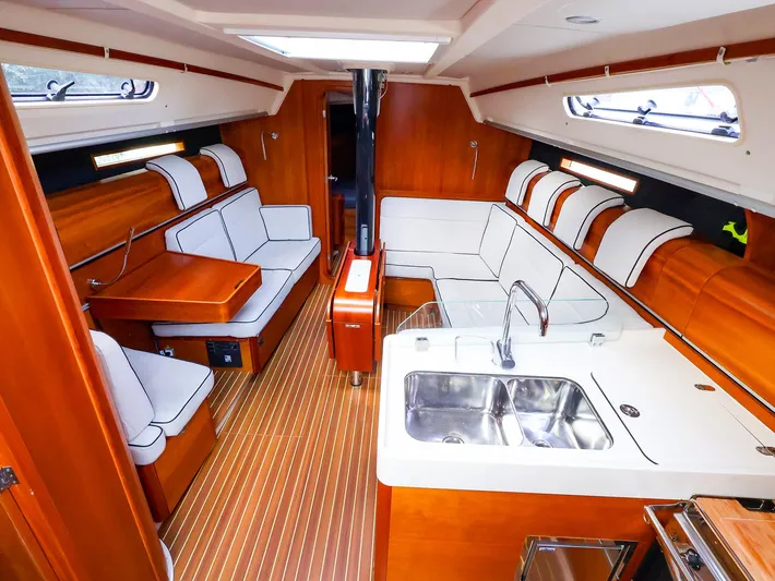 **4806tw Yacht Photos Pics Interior of 2017 Dehler 42c yacht with modern wood finish and white seating.