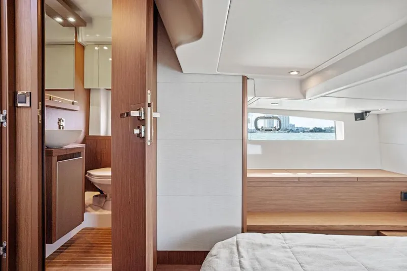 Two Segals Yacht Photos Pics Interior of 2019 Beneteau Gran Turismo 46 yacht, featuring a modern bedroom and bathroom.