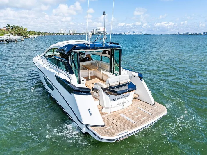 Two Segals Yacht Photos Pics 2019 Beneteau Gran Turismo 46 yacht cruising on a sunny day in open waters.