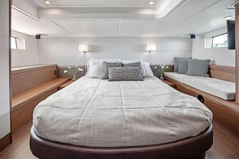 Two Segals Yacht Photos Pics Luxurious cabin interior of 2019 Beneteau Gran Turismo 46 yacht with modern bedding.