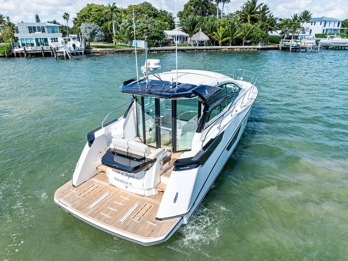 Two Segals Yacht Photos Pics 2019 Beneteau Gran Turismo 46 yacht cruising in scenic coastal waters.