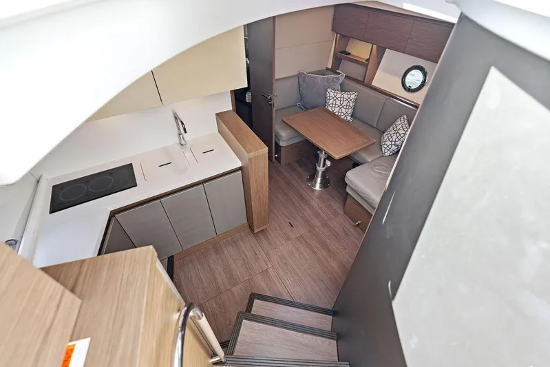 Two Segals Yacht Photos Pics Luxurious interior of 2019 Beneteau Gran Turismo 46 yacht with modern kitchen and cozy seating area.