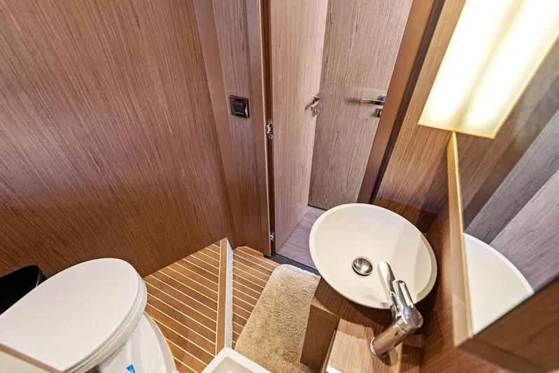 Two Segals Yacht Photos Pics 2019 Beneteau Gran Turismo 46 yacht bathroom with modern sink and wooden accents.